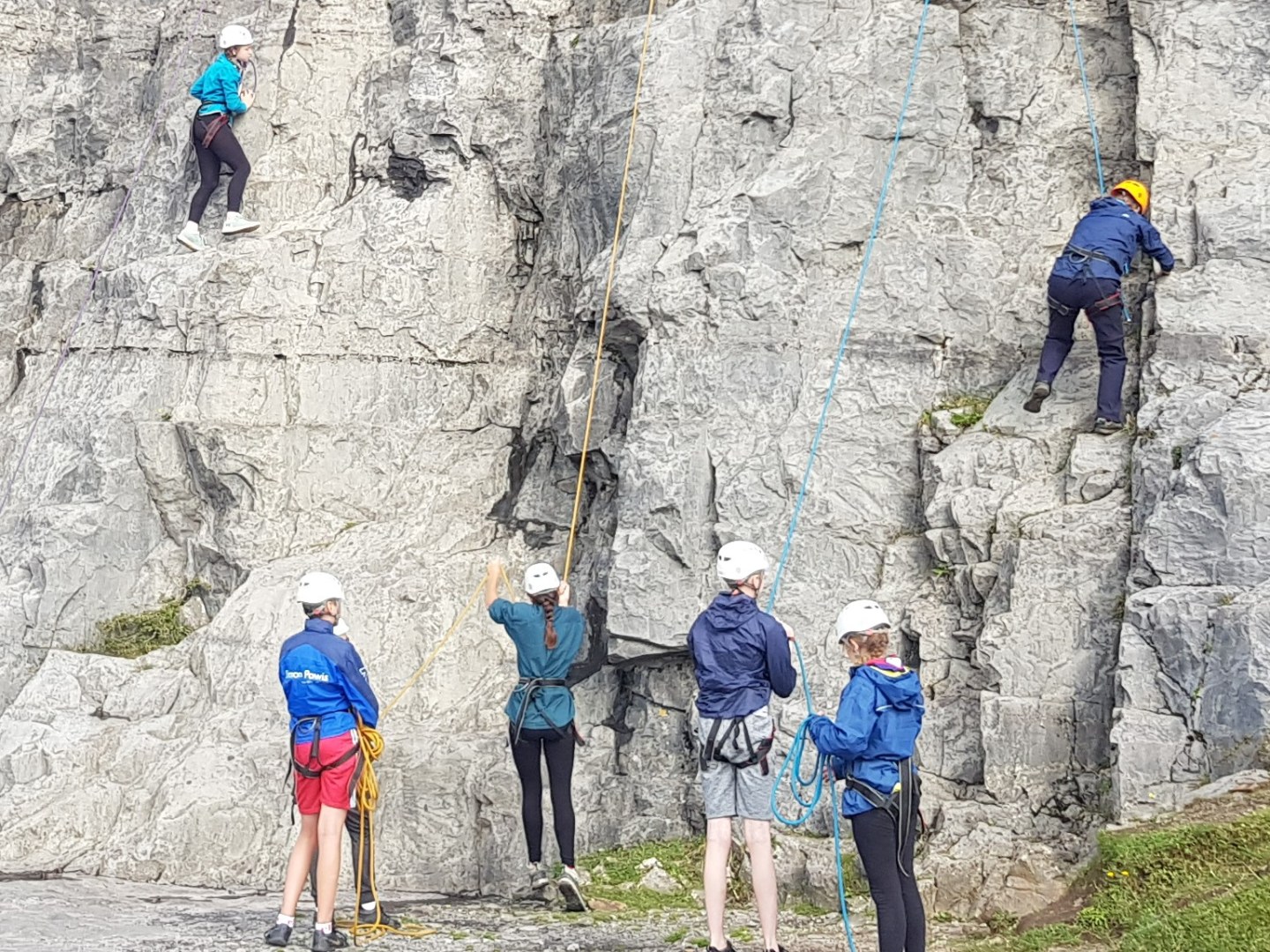 a group of people standing on top of a mountain