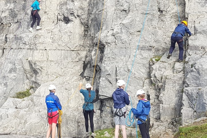 a group of people standing on top of a mountain