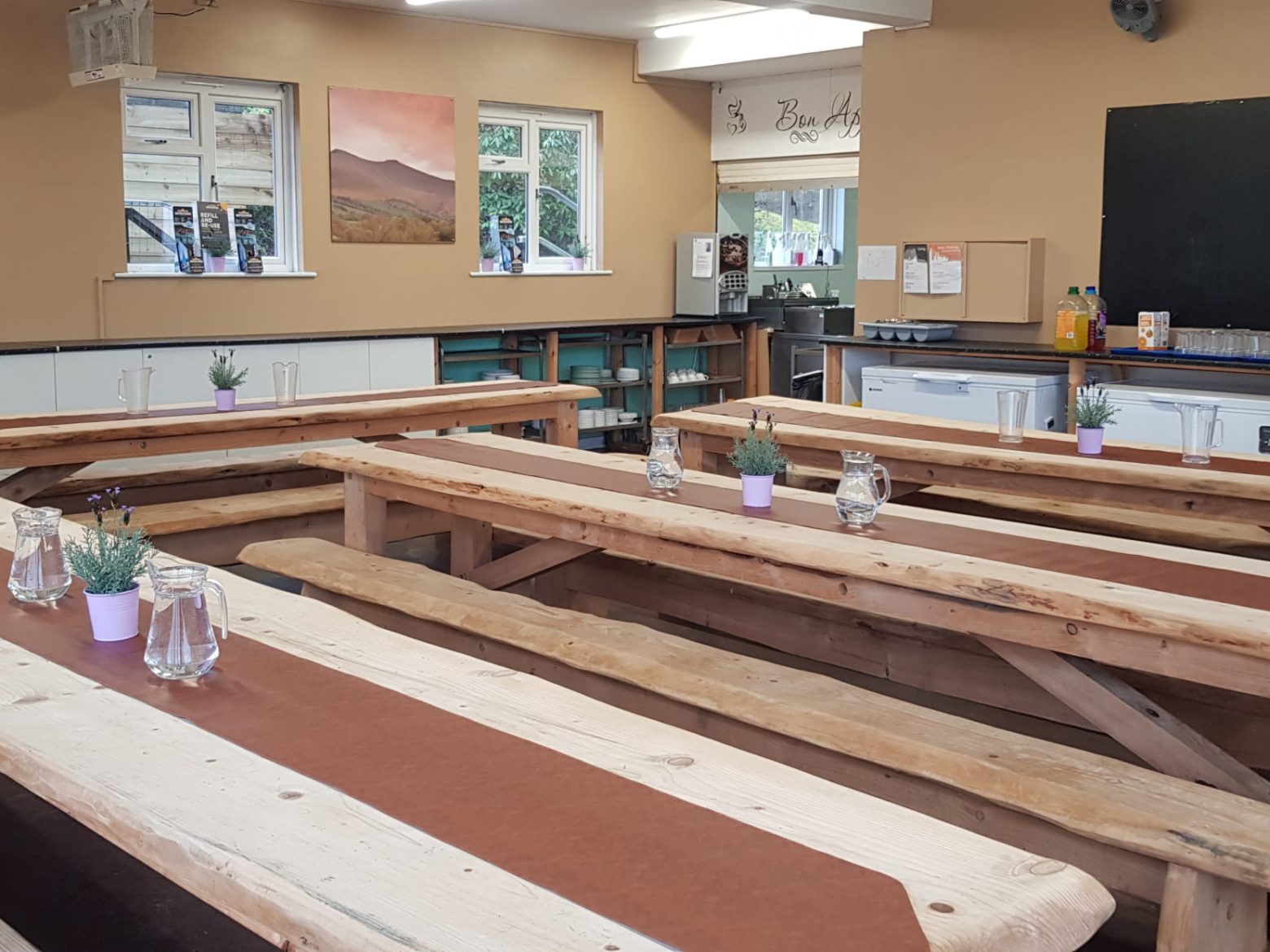 a wooden bench sitting next to a fireplace