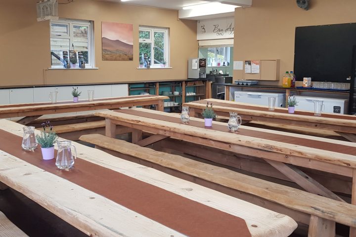 a wooden bench sitting next to a fireplace