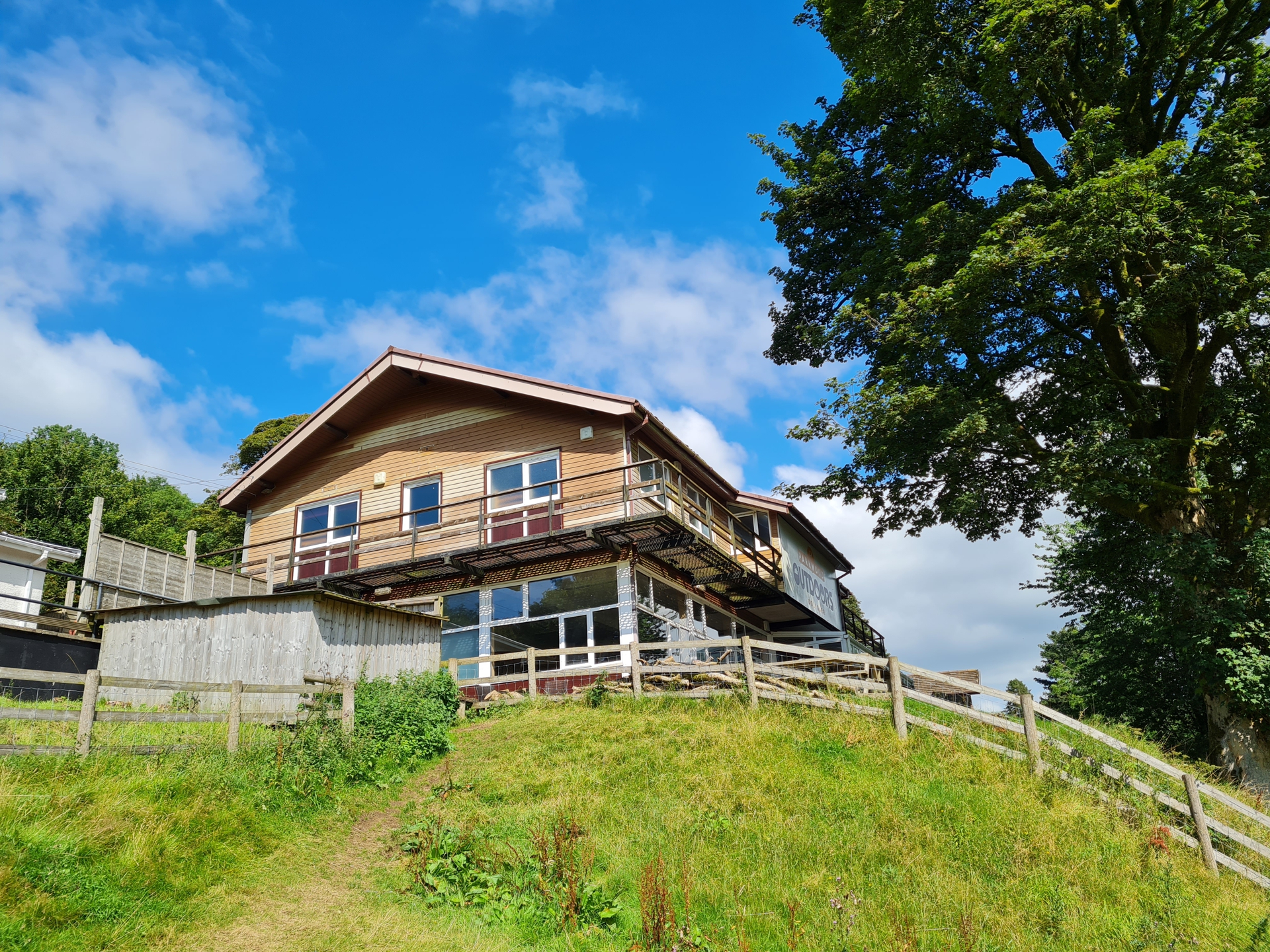 a house on a grassy hill