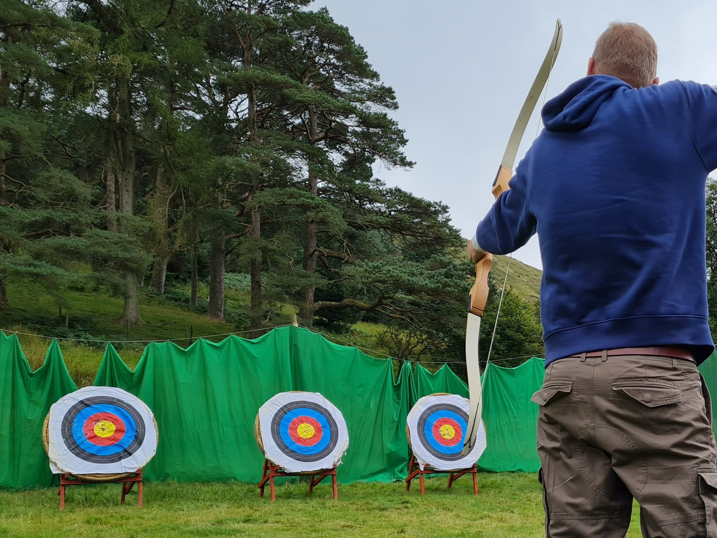 a young boy holding a kite