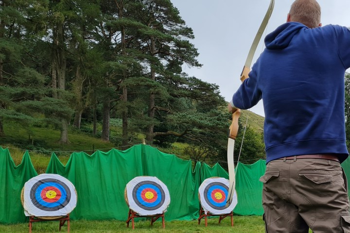 a young boy holding a kite