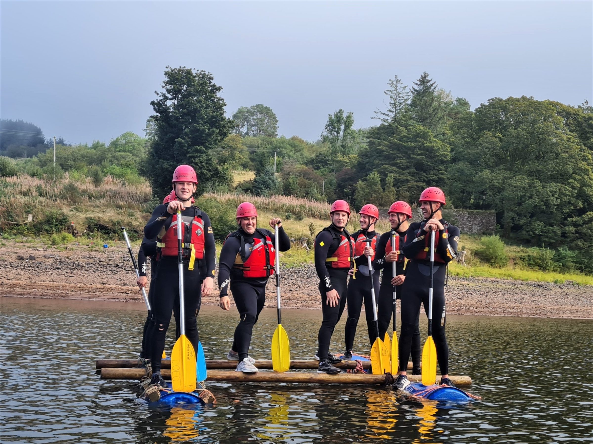 a group of people that are standing in the water