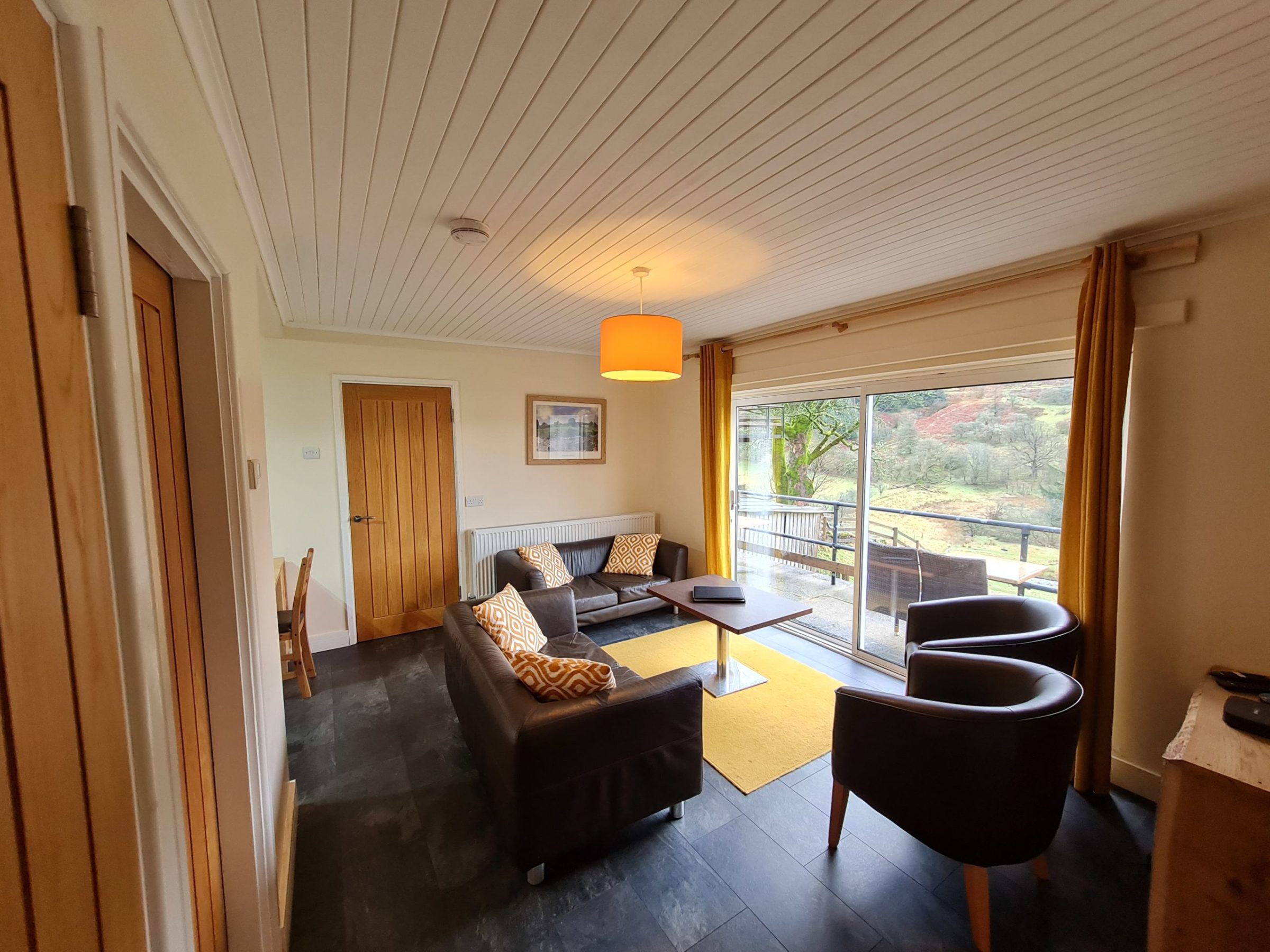 a living room filled with furniture and a large window