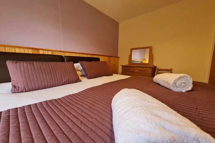 a bedroom with a bed in a hotel room