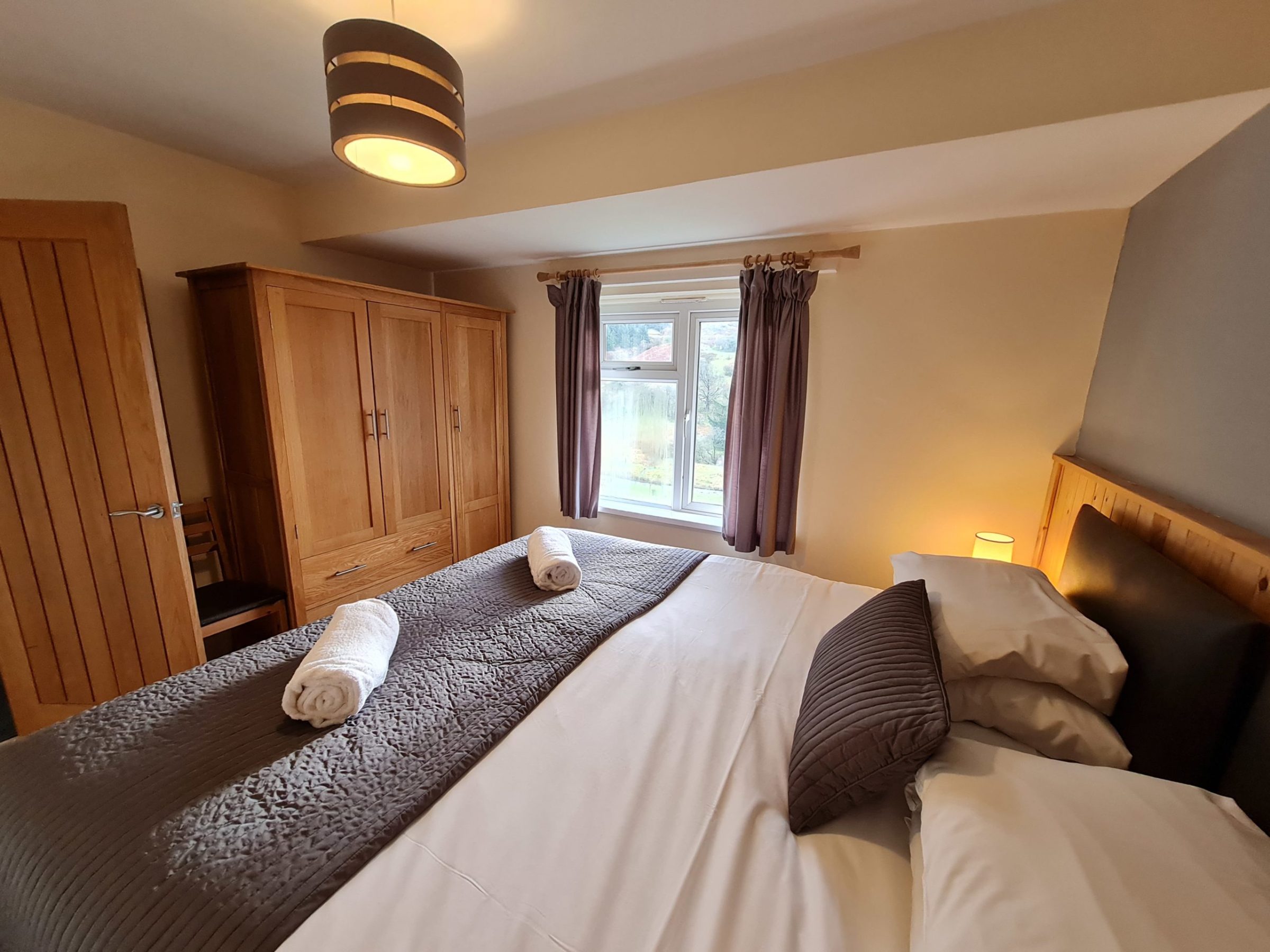 a bedroom with a large bed in a hotel room