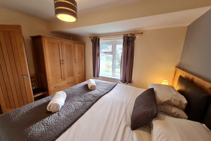 a bedroom with a large bed in a hotel room