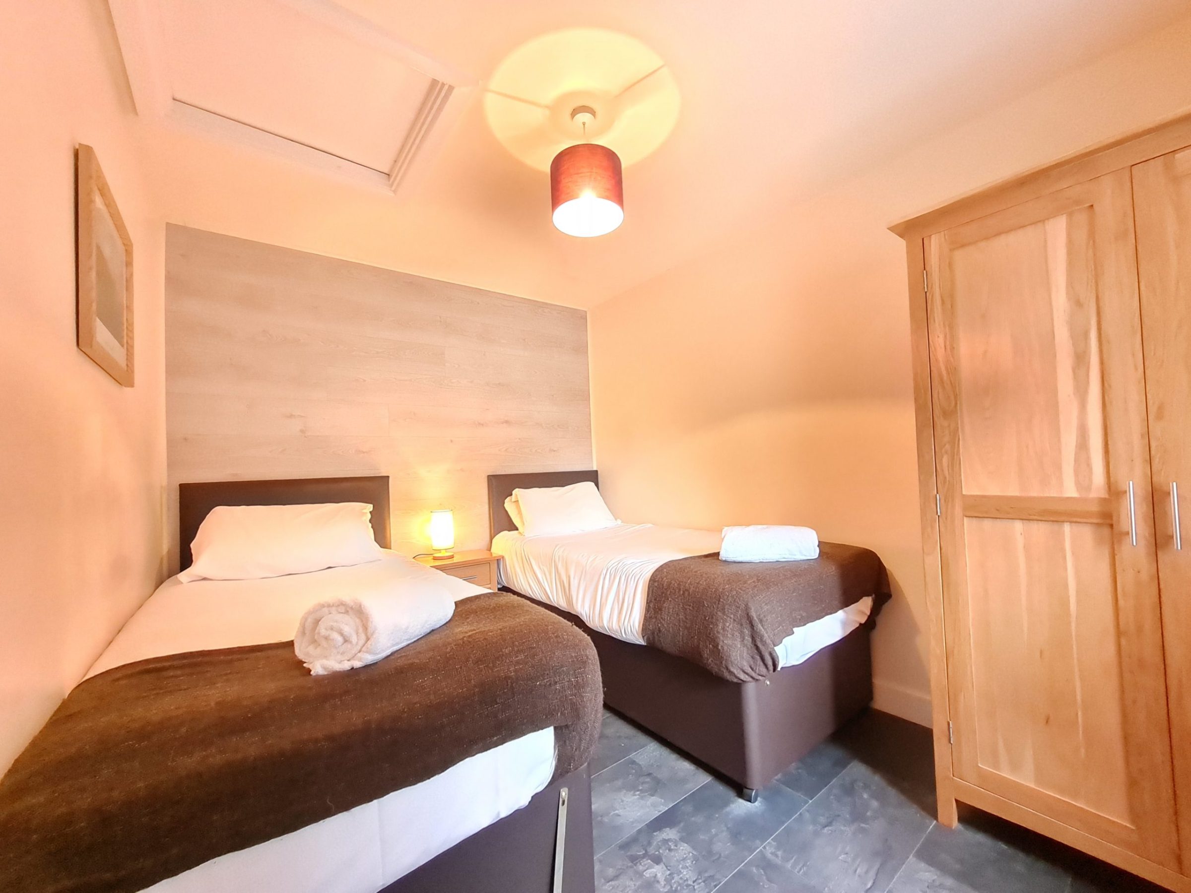 a bedroom with a bed in a room