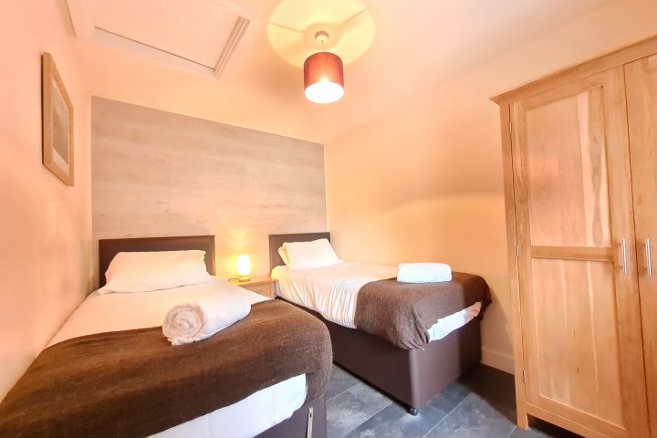 a bedroom with a bed in a room