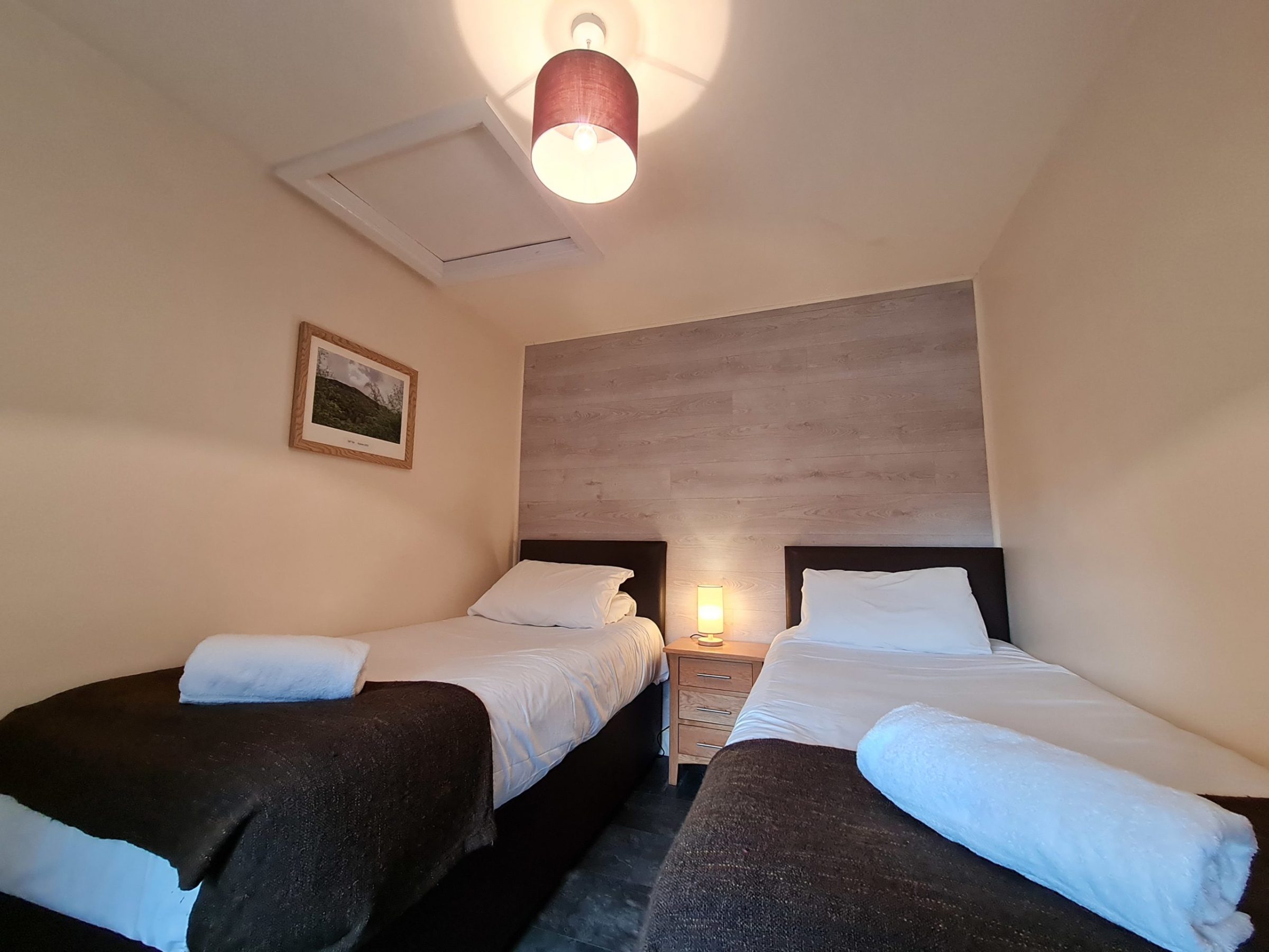 a bedroom with a bed in a hotel room