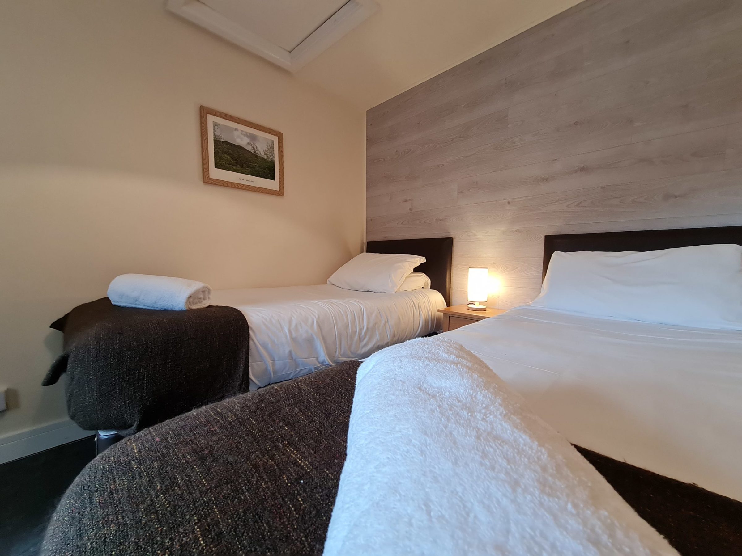 a bedroom with a bed in a hotel room