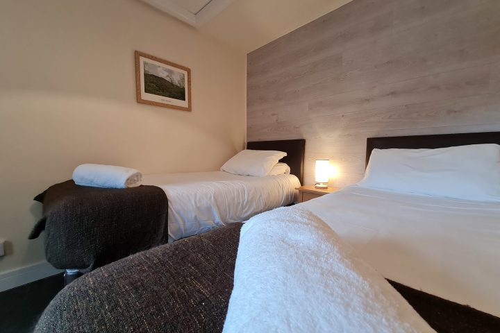 a bedroom with a bed in a hotel room