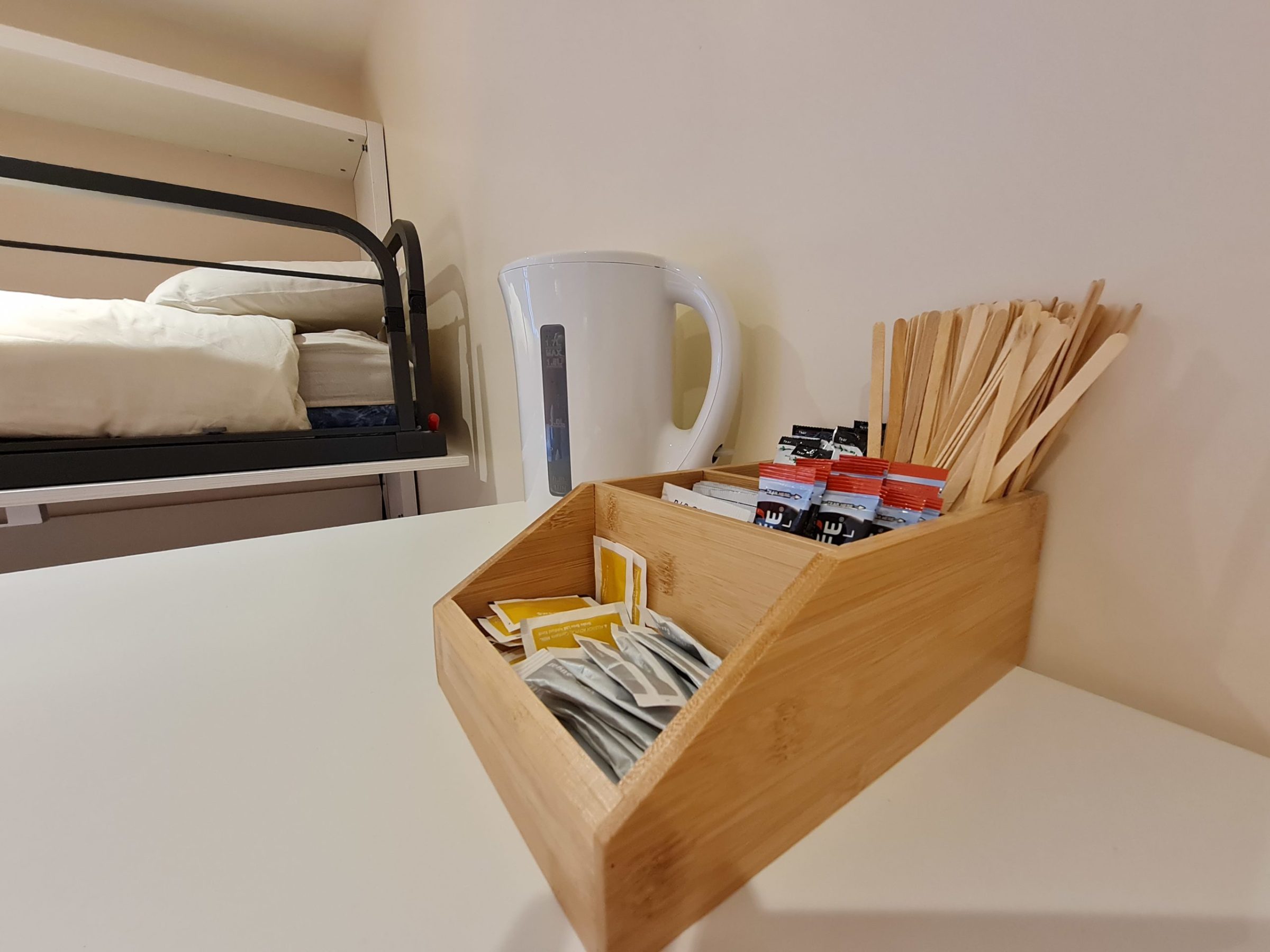 a bedroom with a bed in a box