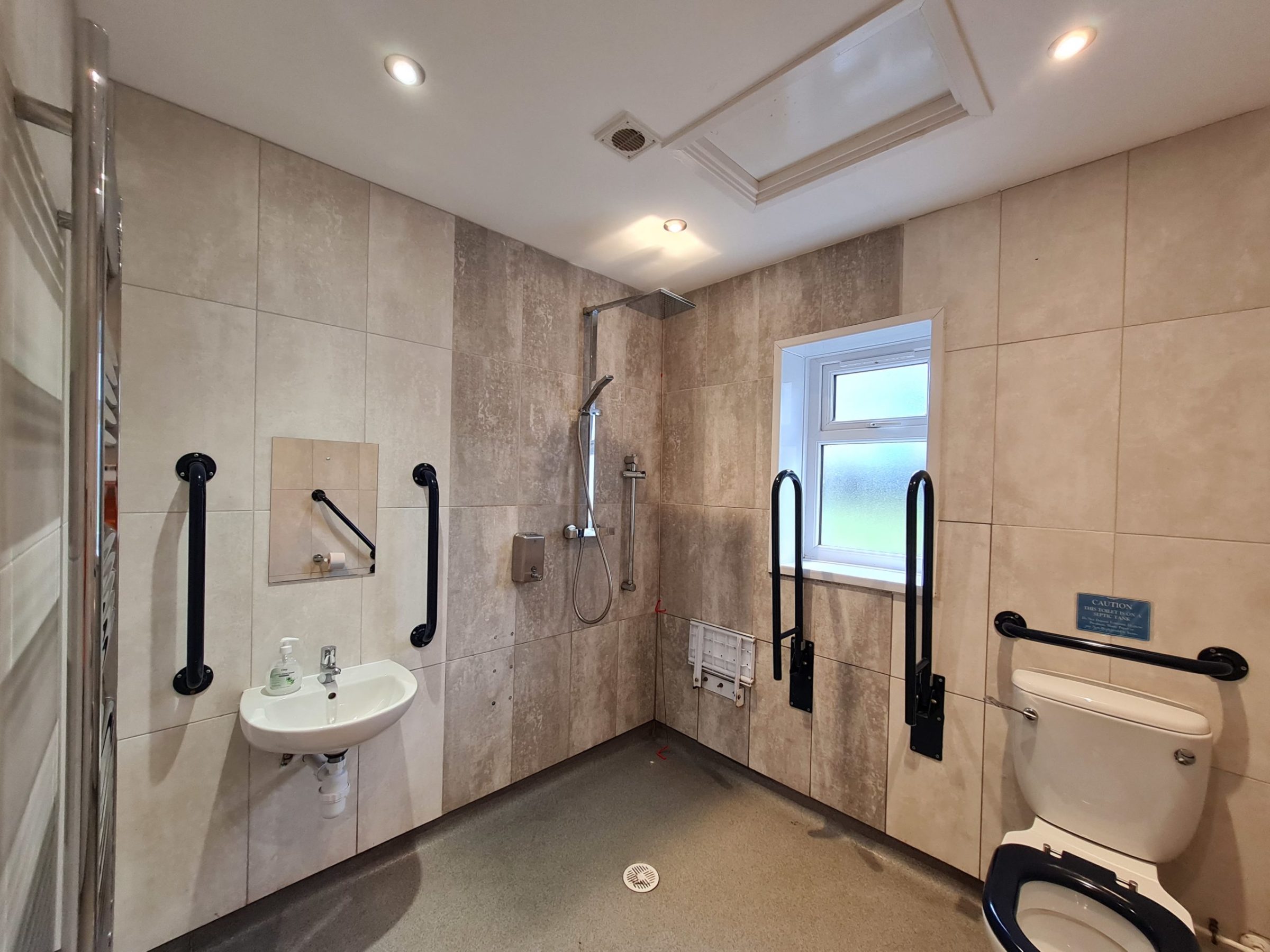 a room with a sink and a mirror