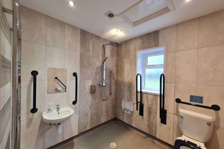 a room with a sink and a mirror