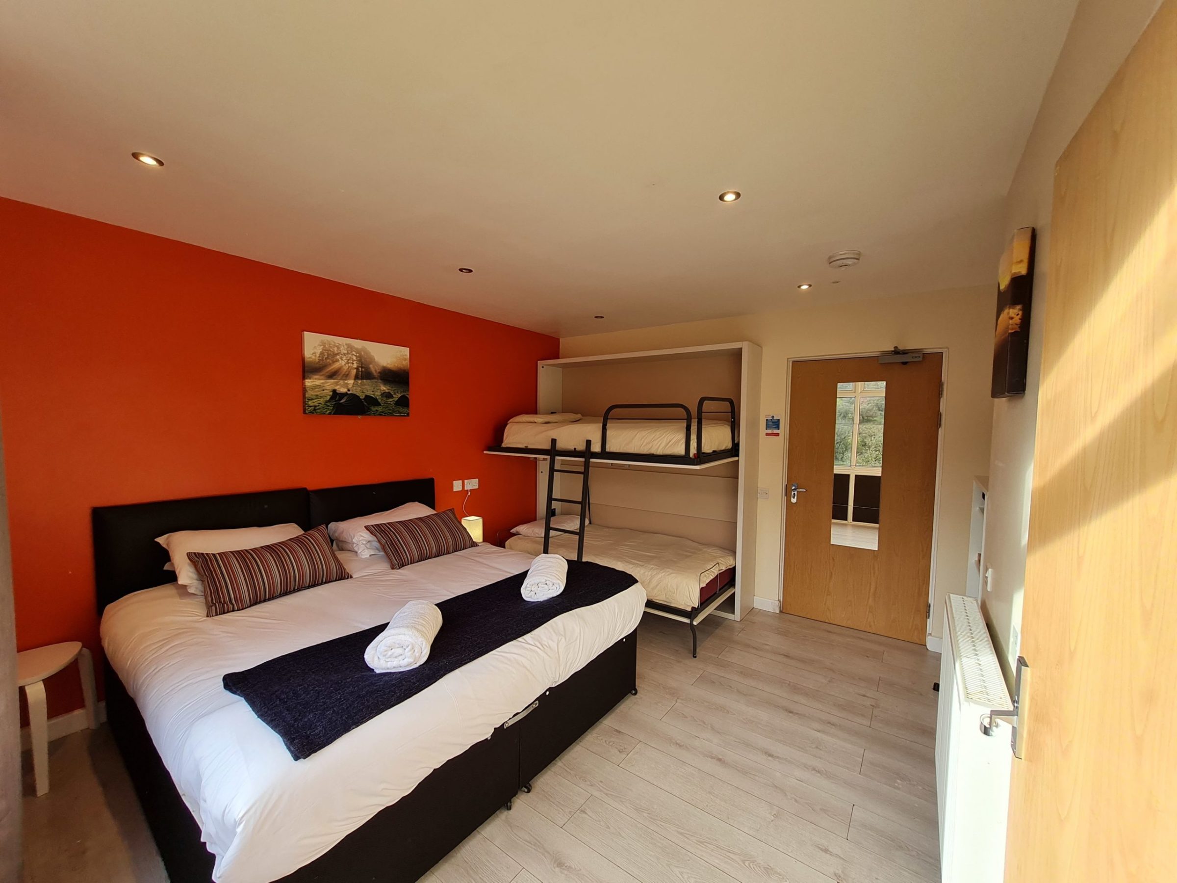 a bedroom with a bed in a room