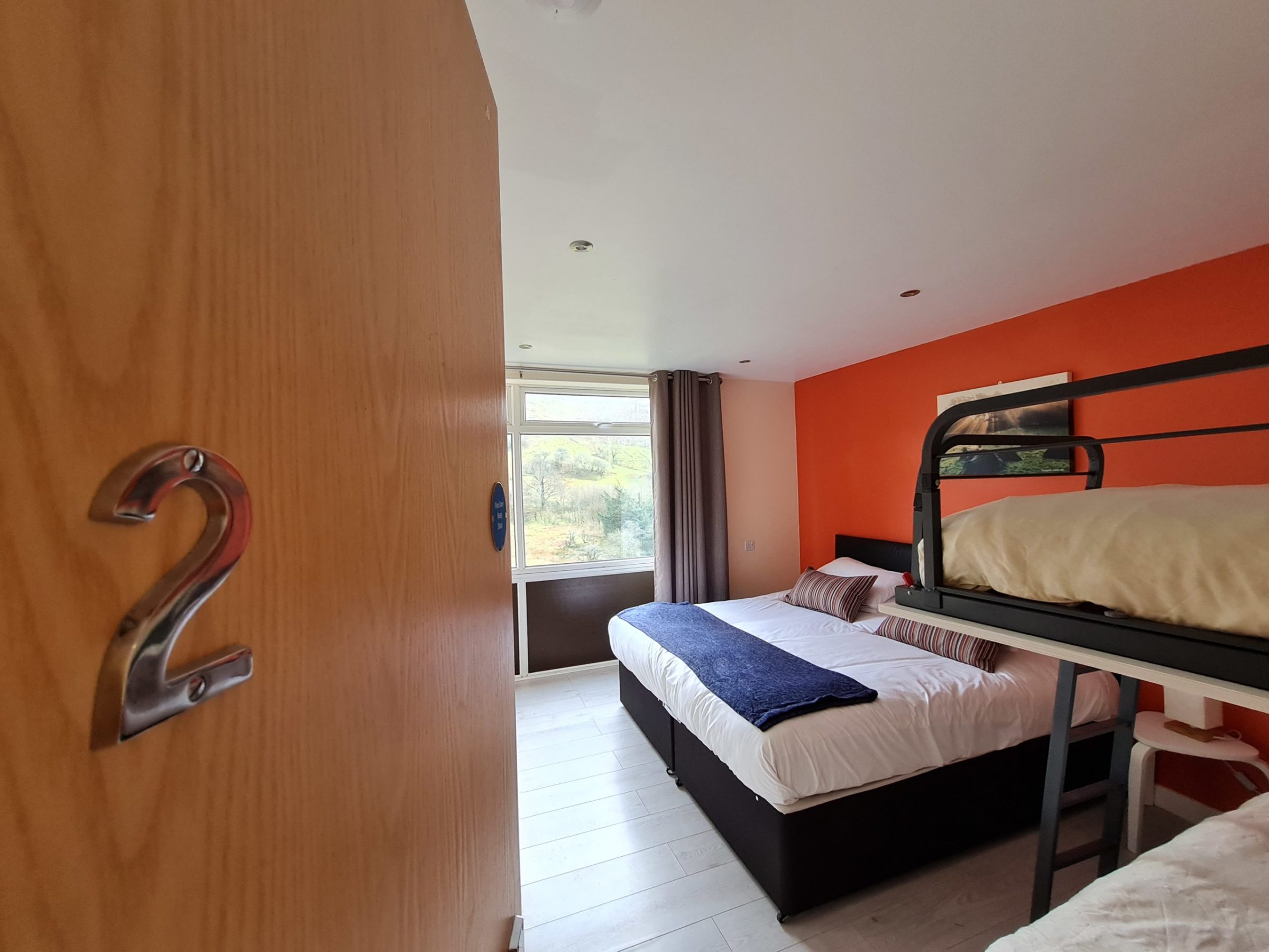 a bedroom with a bed in a room