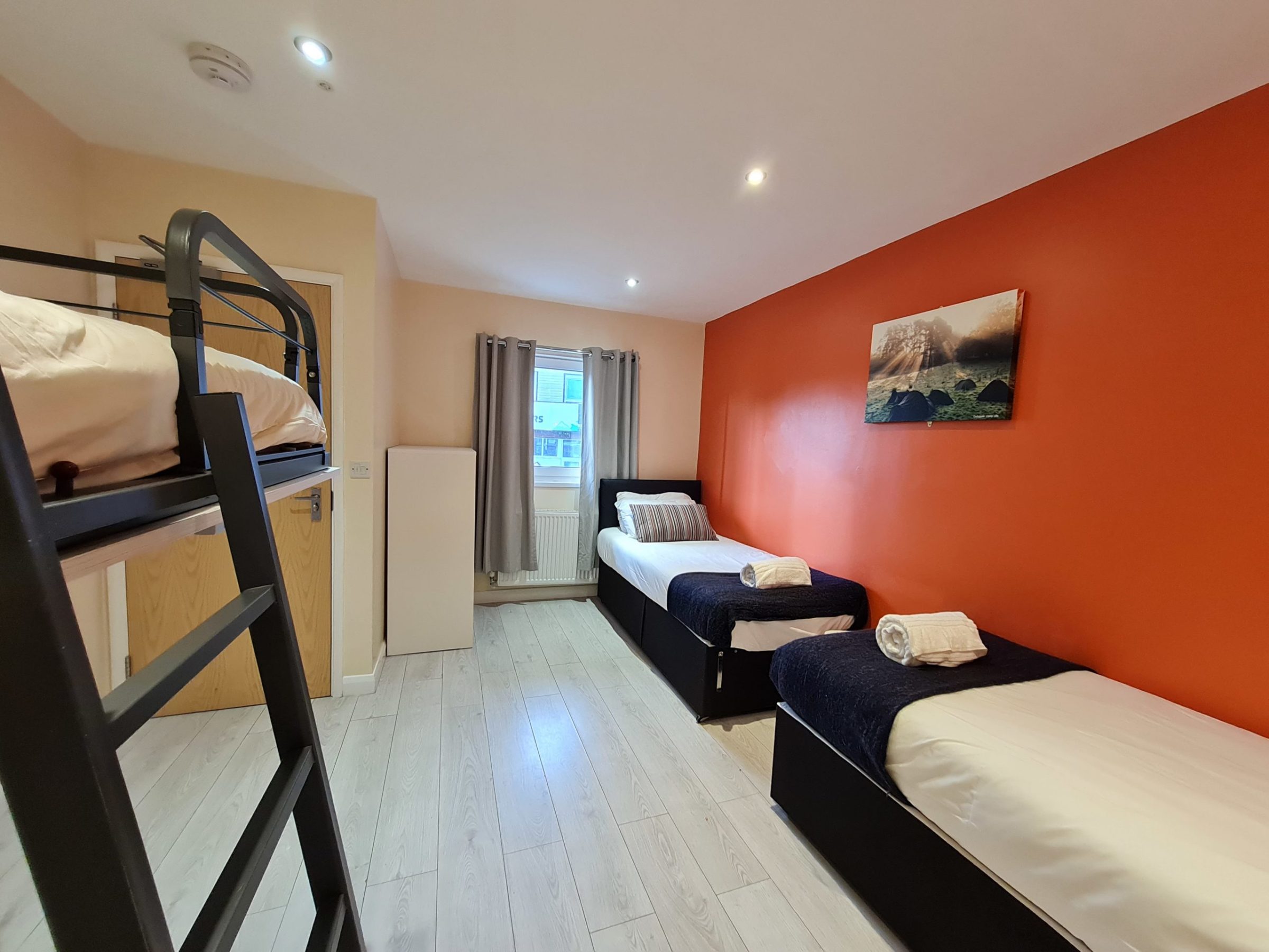 a bedroom with a bed in a room