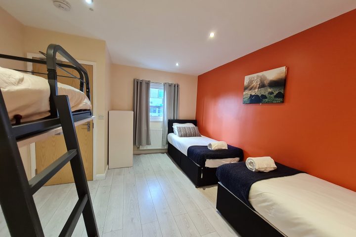 a bedroom with a bed in a room