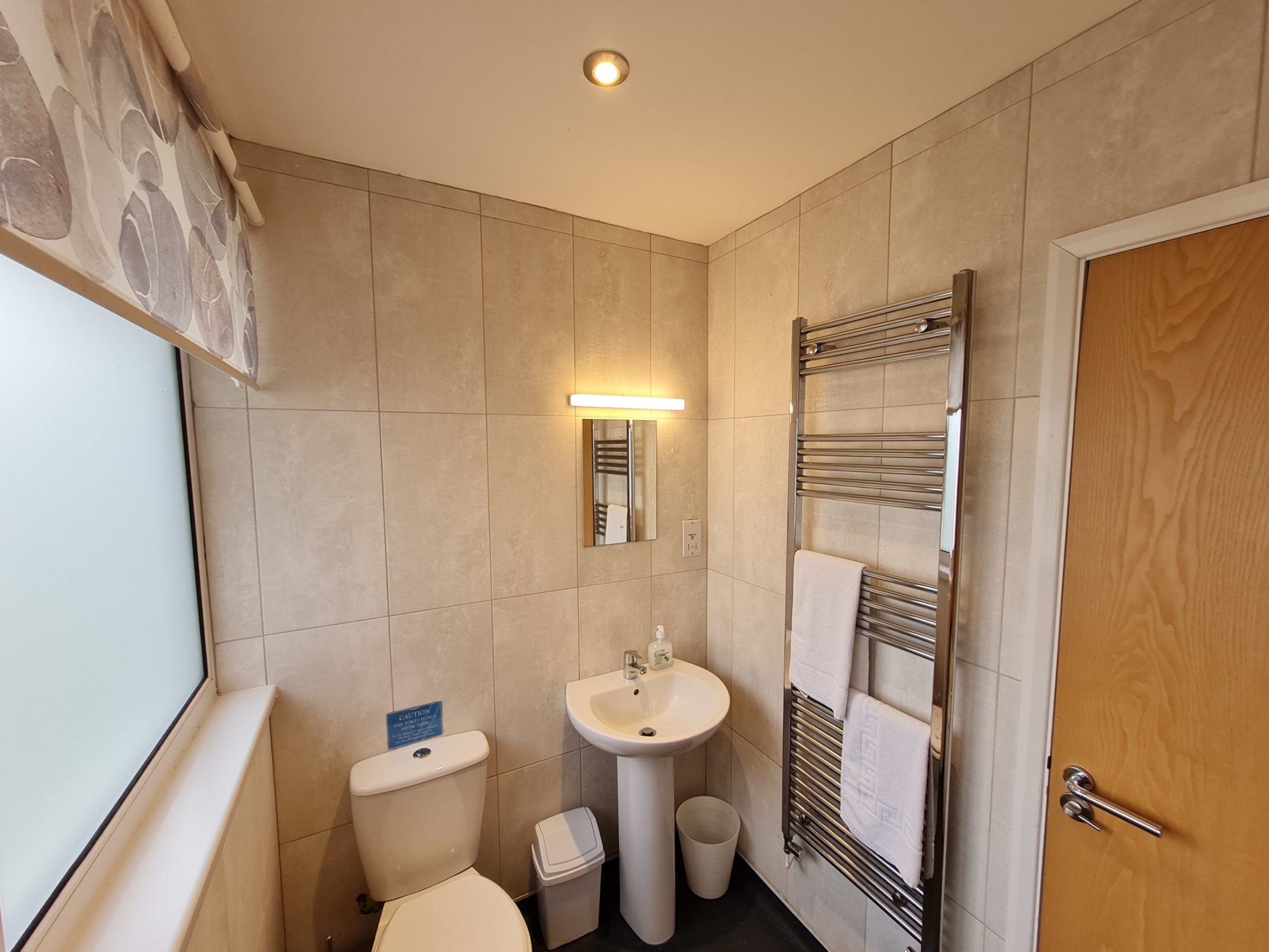 a room with a sink and a mirror