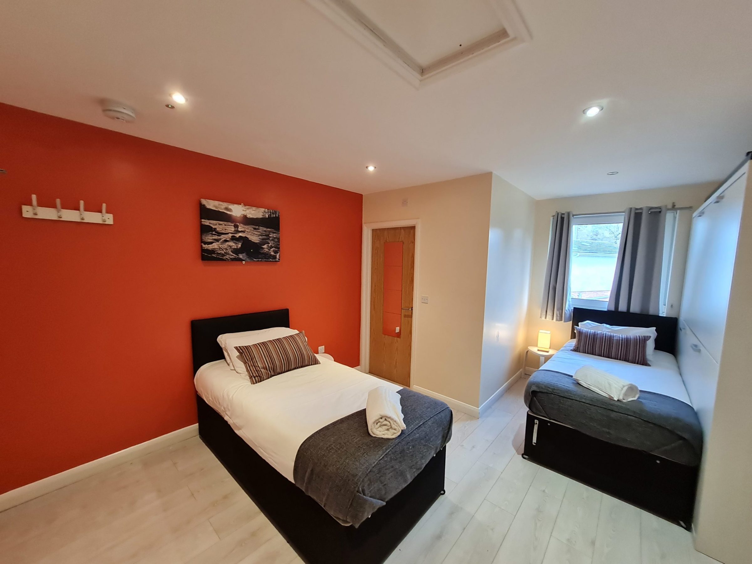 a bedroom with a bed in a room