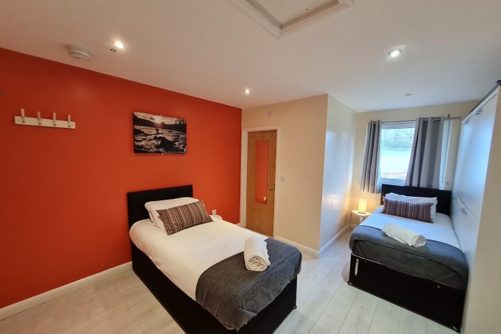 a bedroom with a bed in a room