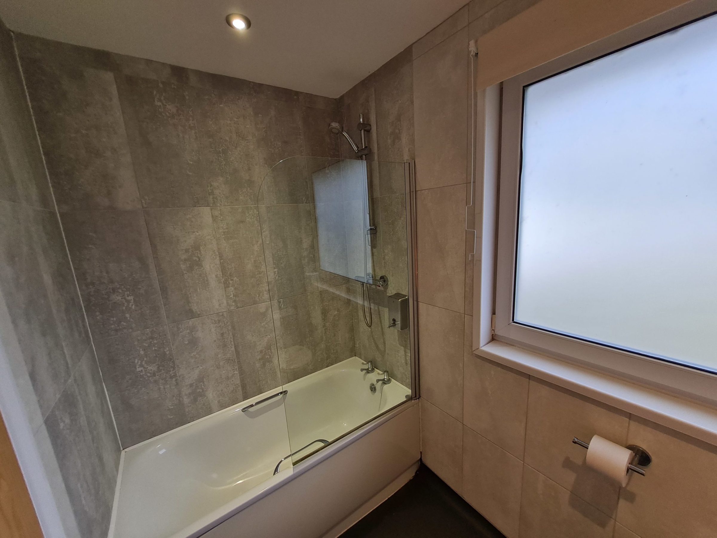 a sink sitting under a window