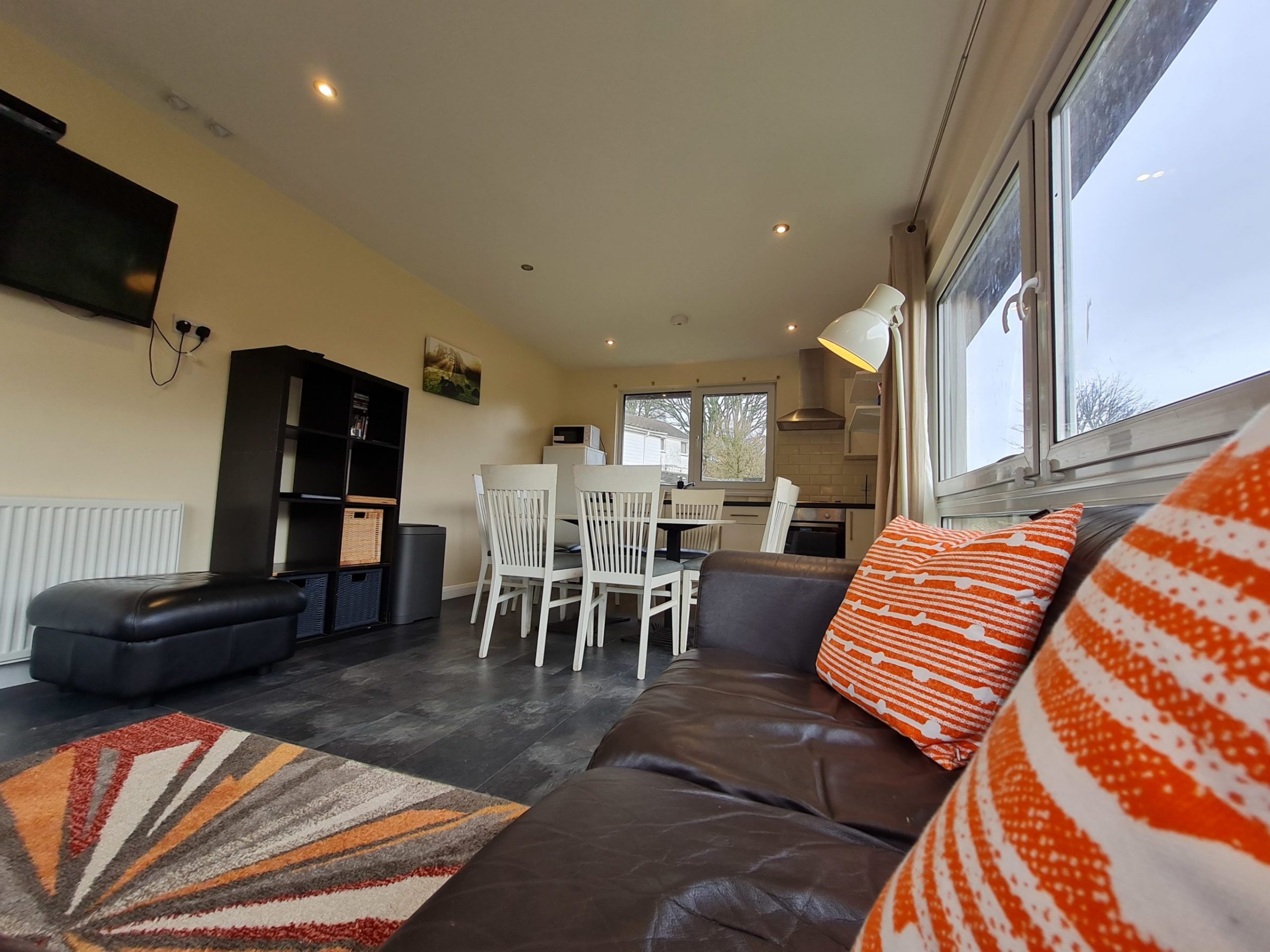 a living room filled with furniture and a rug