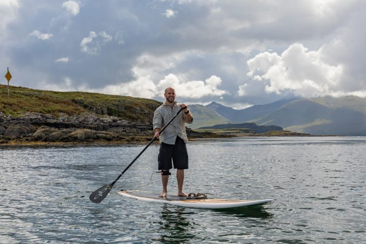a man water skiing behind a boat