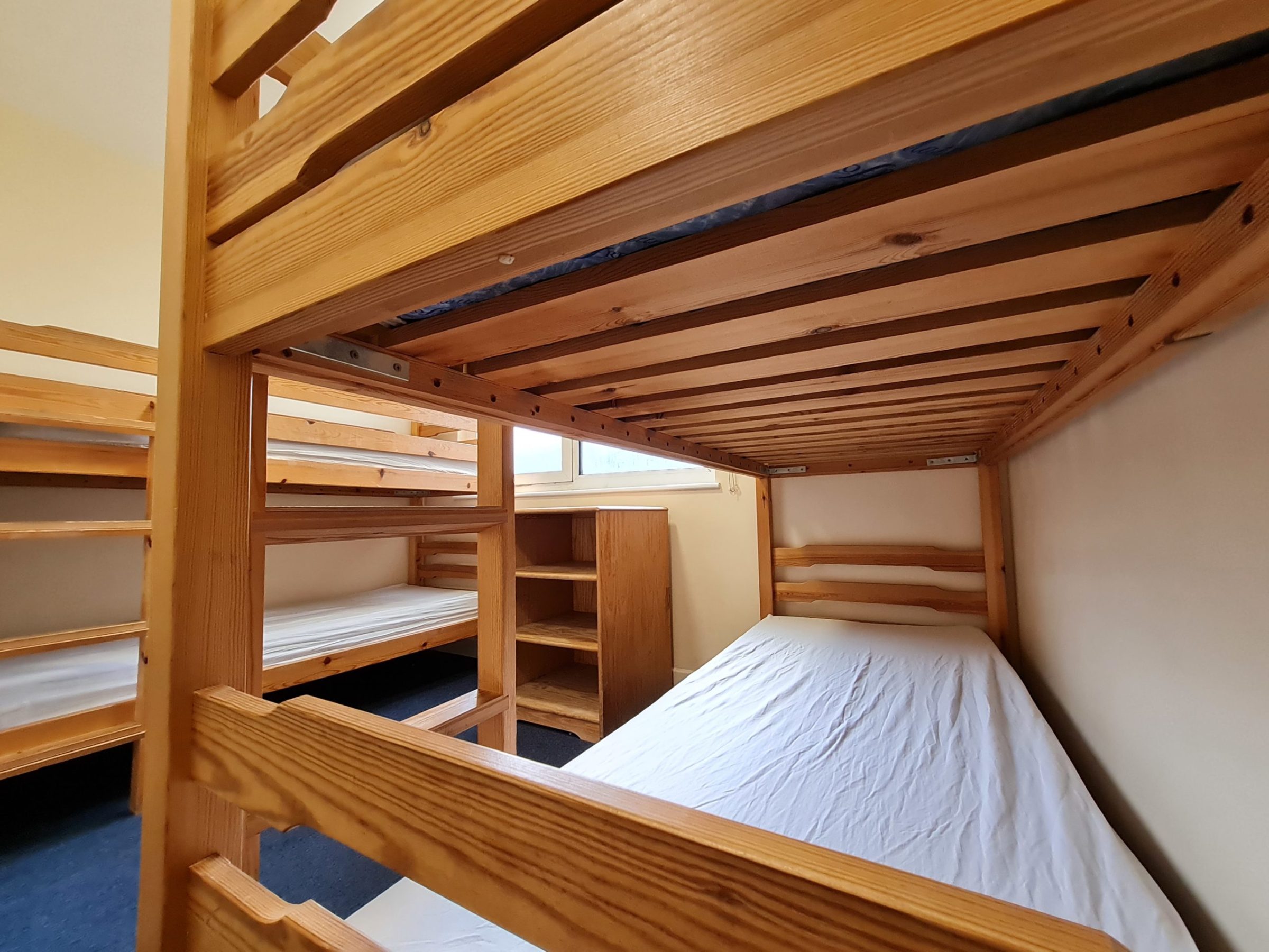 a bedroom with a bed and chair