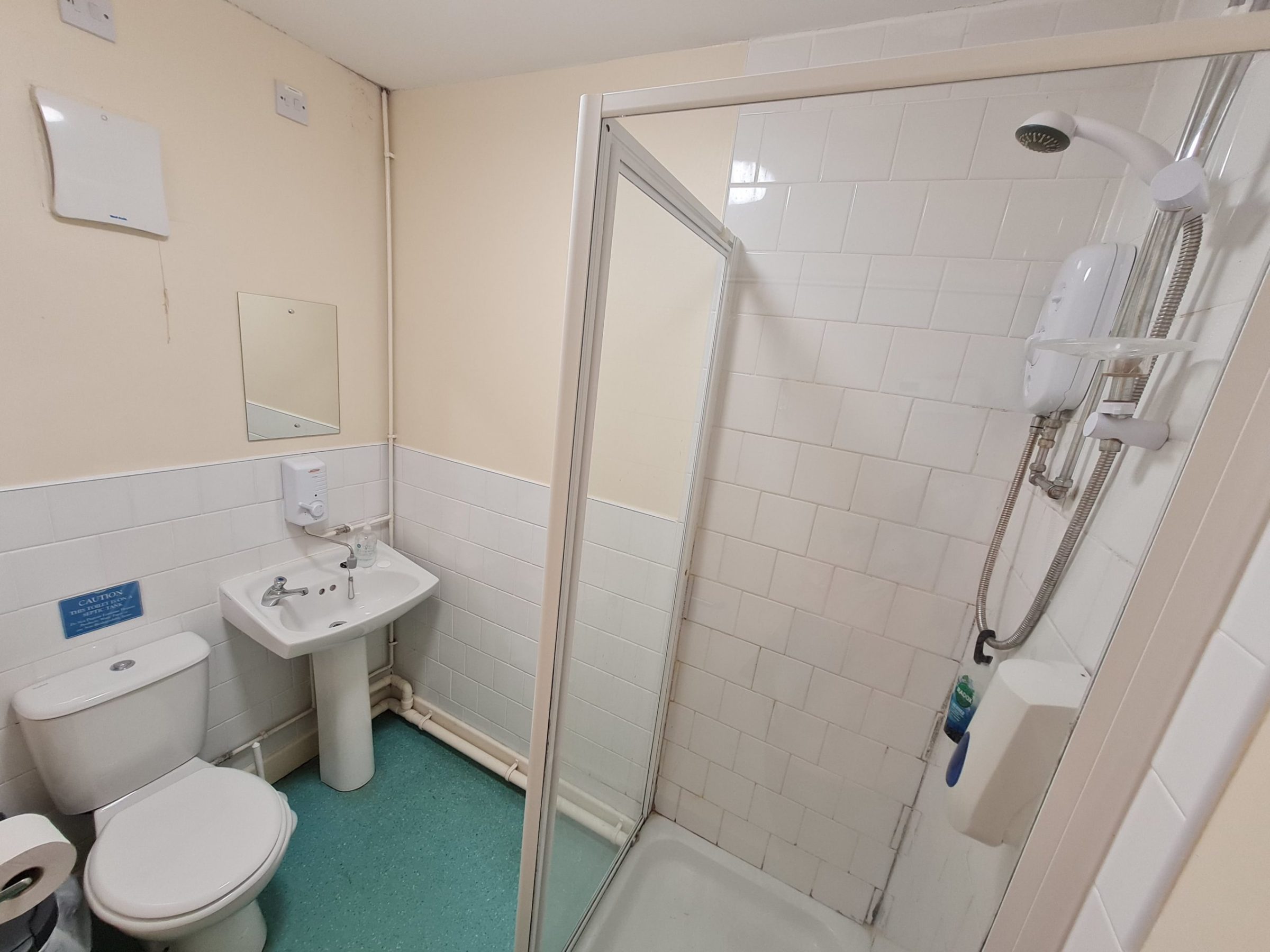 a room with a sink and a mirror