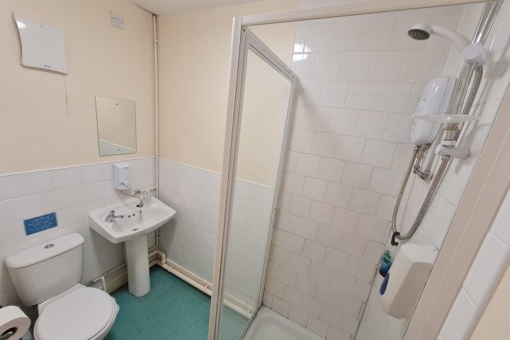 a room with a sink and a mirror