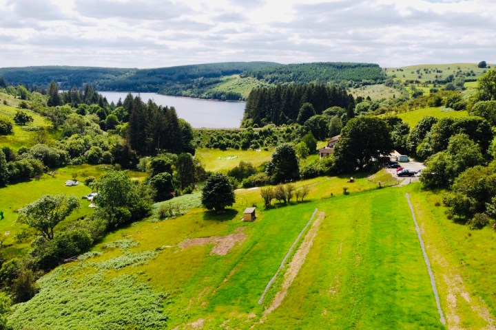 a view of a lush green hillside