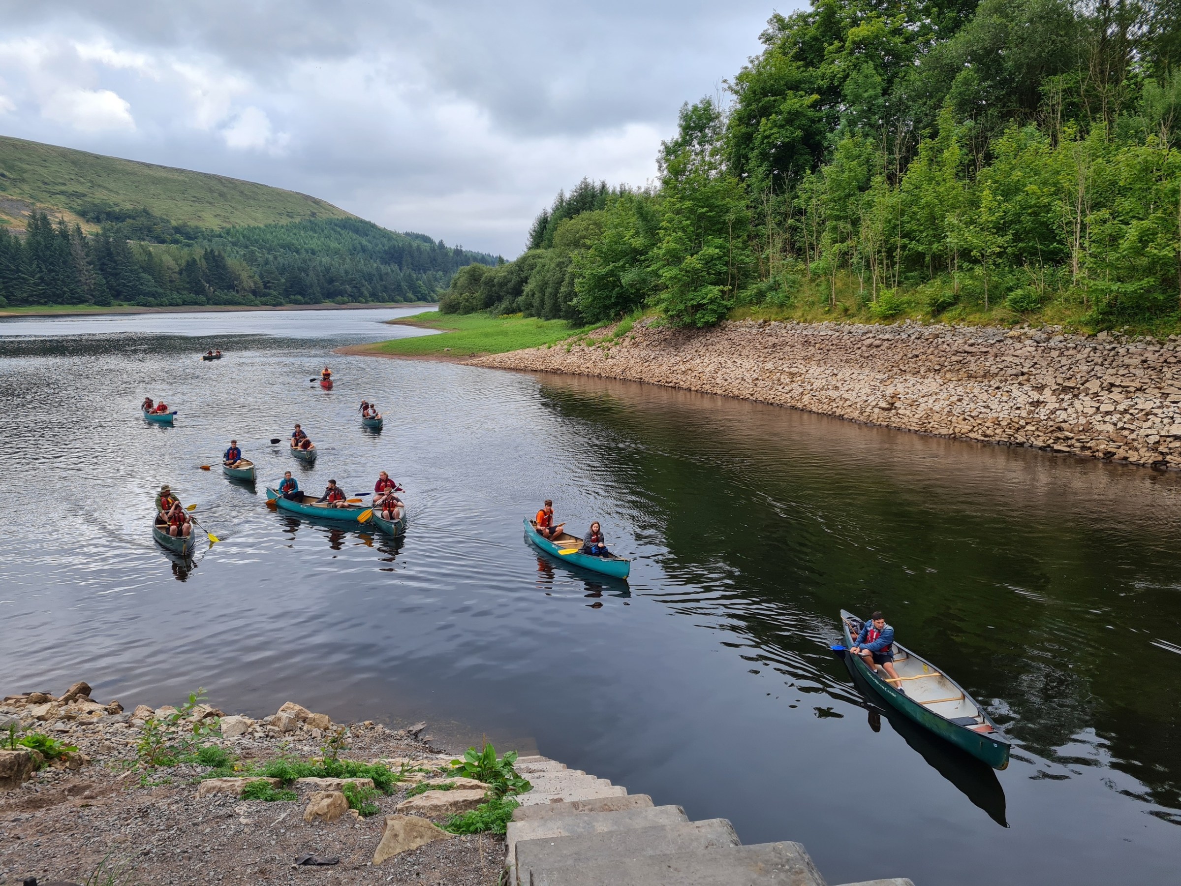 a group of people riding skis on a body of water