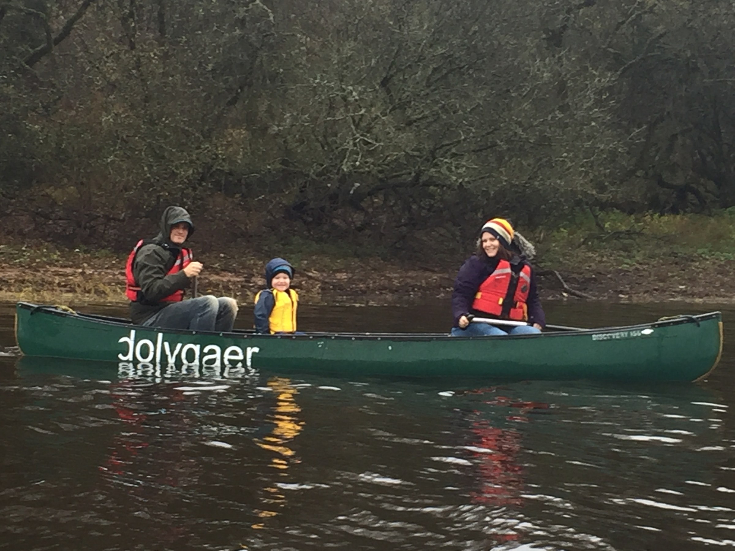 a group of people riding on the back of a boat