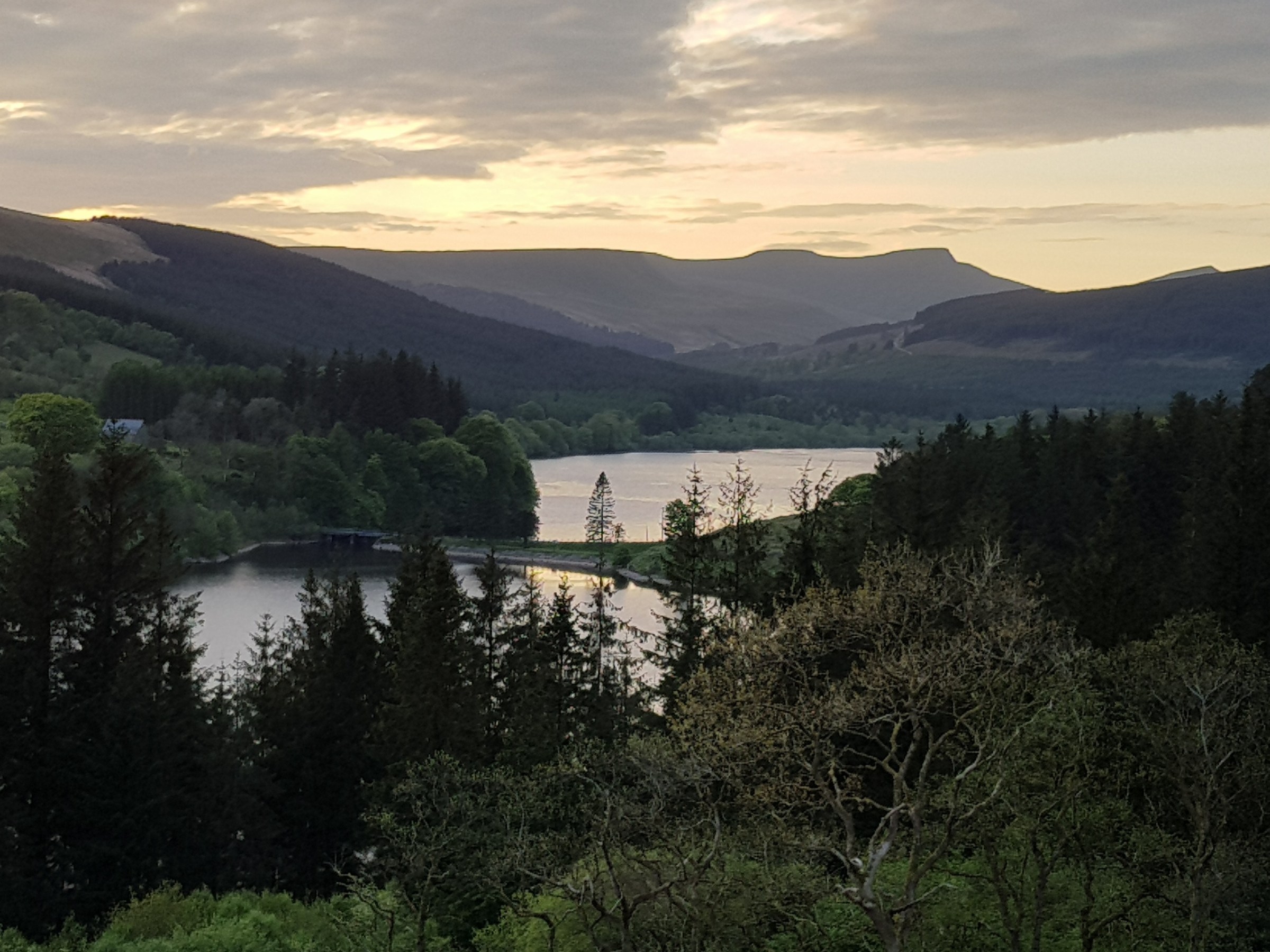 a view of a body of water with a mountain in the background