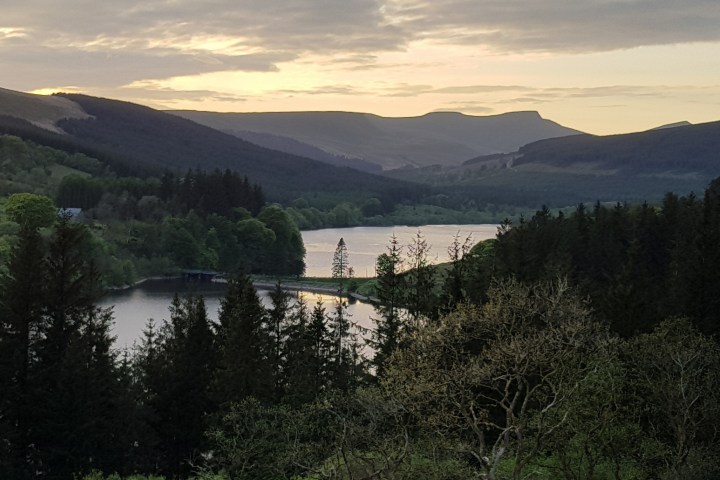 a view of a body of water with a mountain in the background