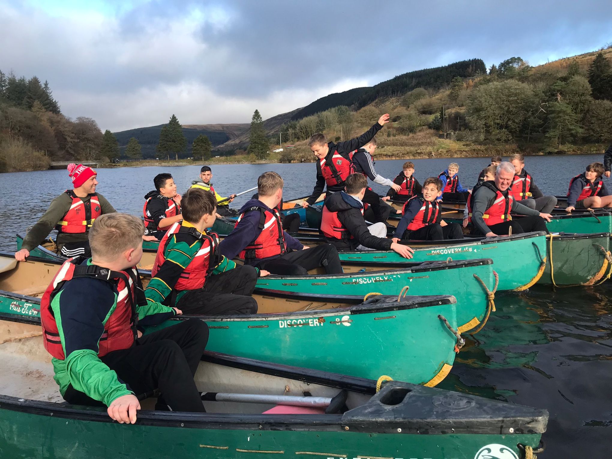 a group of people sitting on a boat