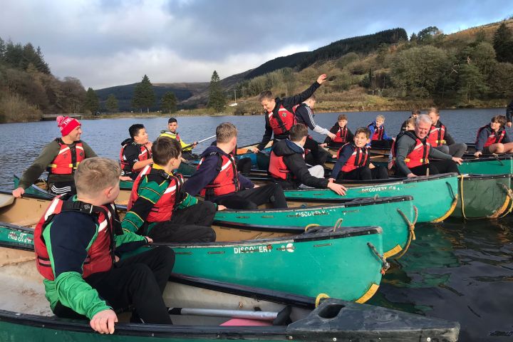 a group of people sitting on a boat