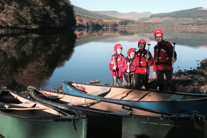 a group of people riding on the back of a boat