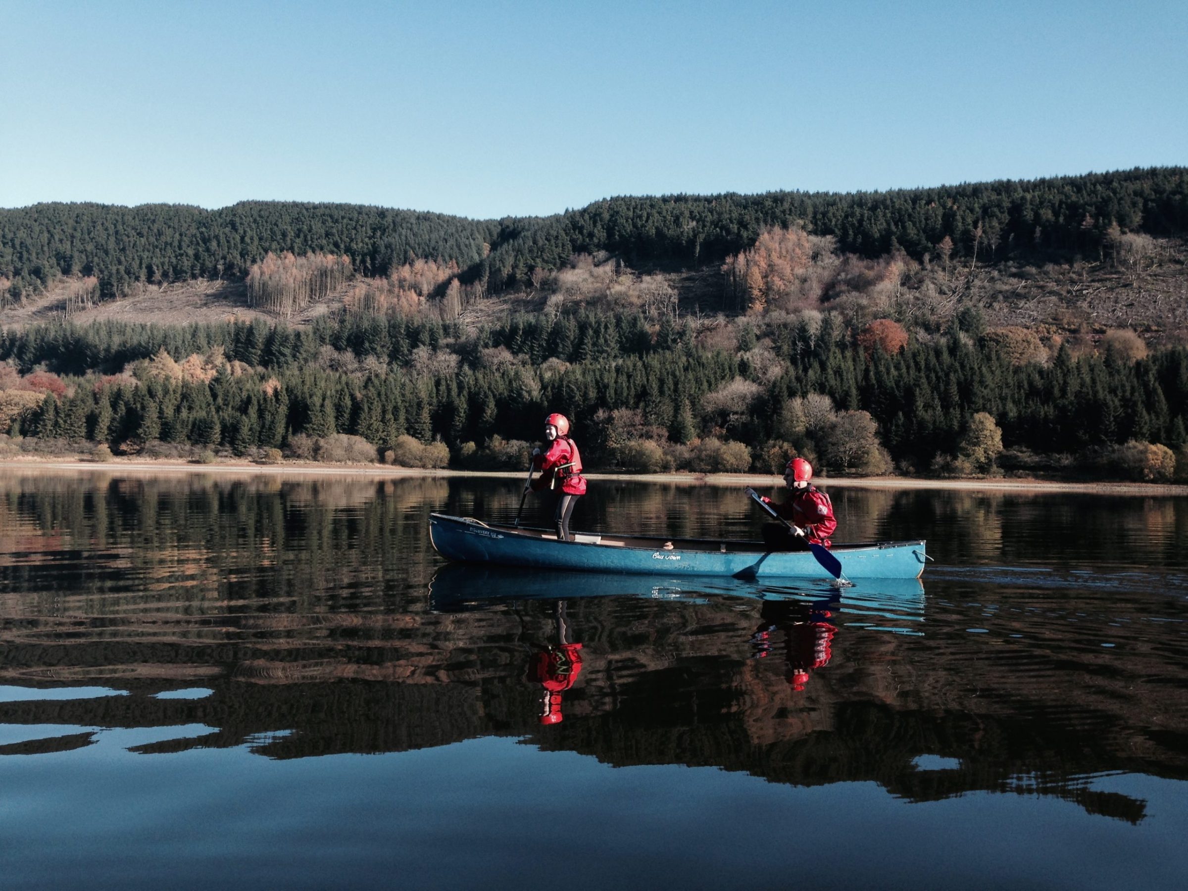 a group of people riding skis on a body of water