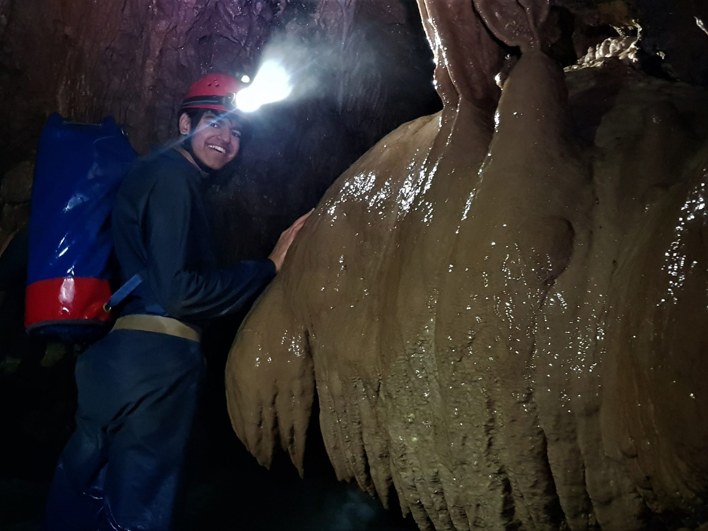a man riding a elephant in the water