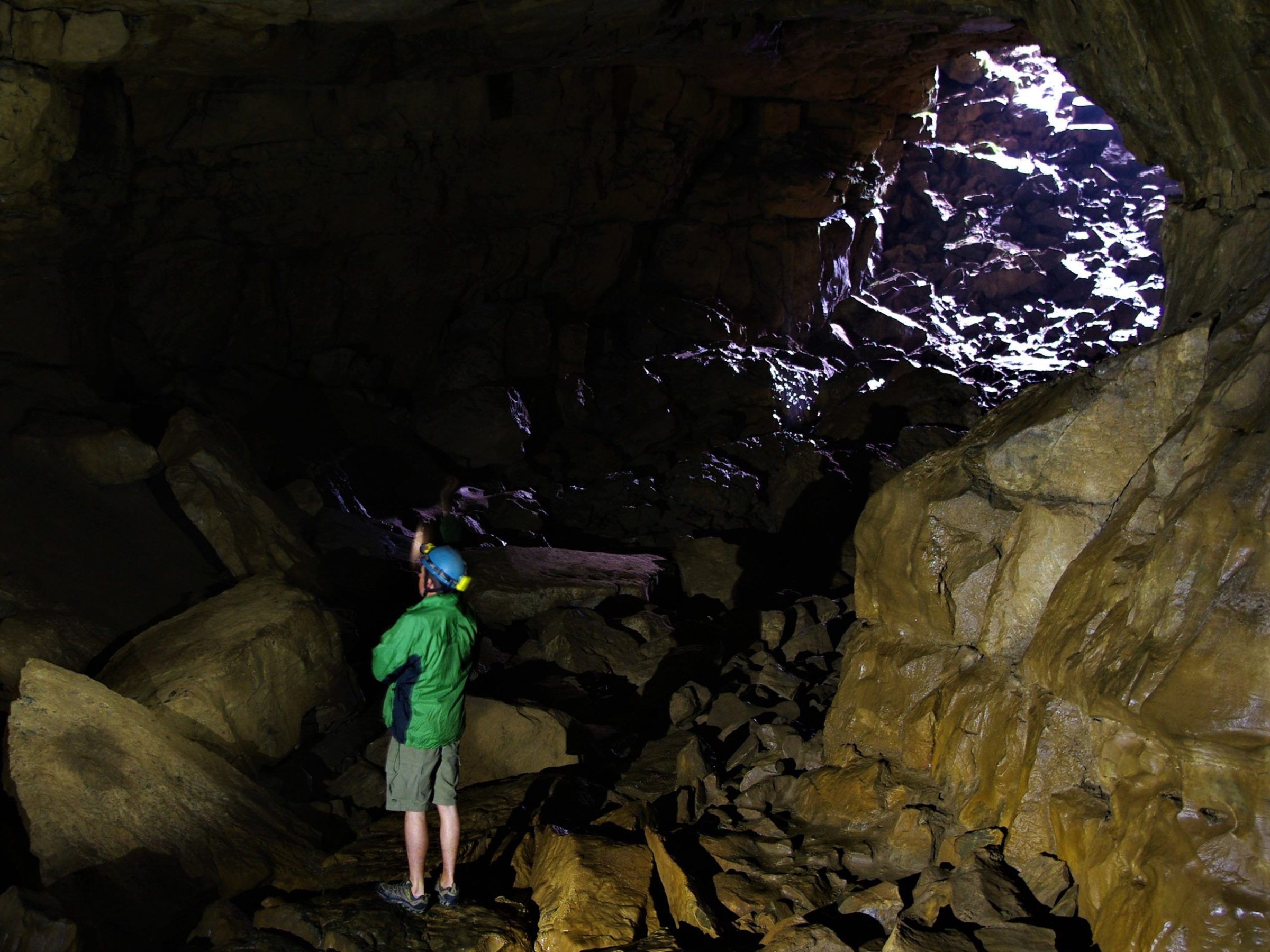 a young man in a cave
