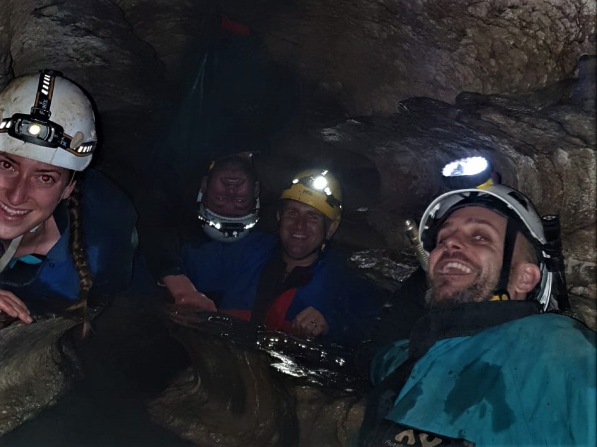 a group of people on a cave