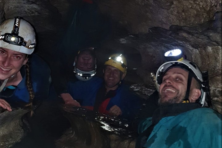 a group of people on a cave