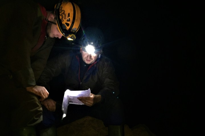 a man standing in a dark room