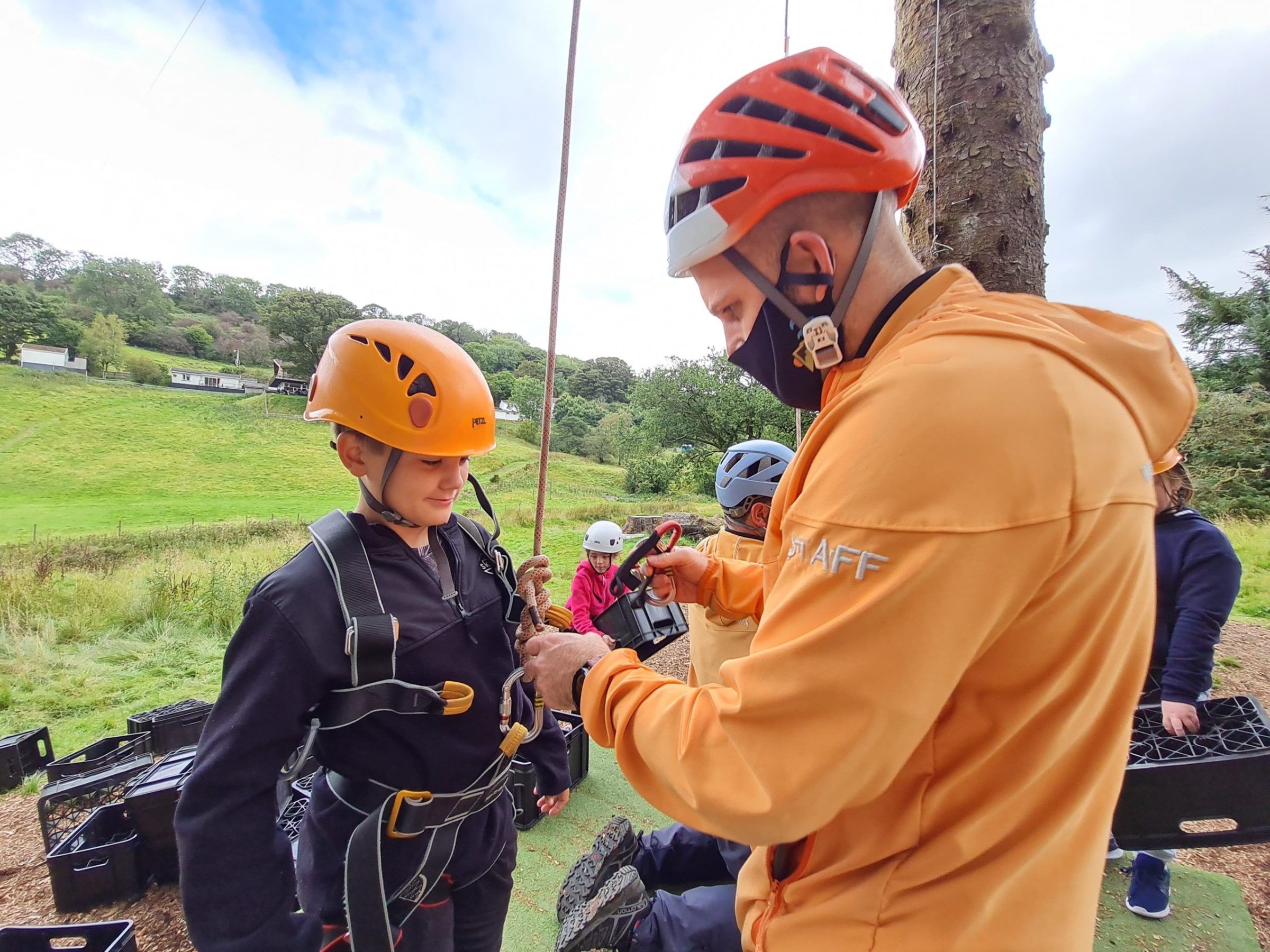 a young boy holding a baseball bat