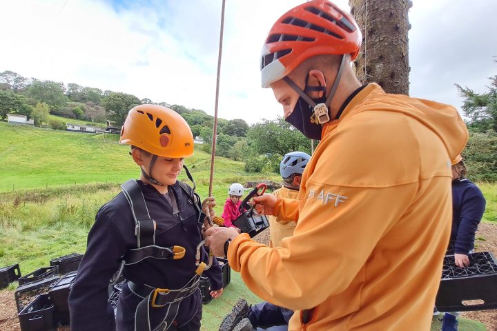 a young boy holding a baseball bat