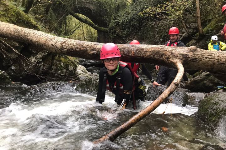 a man riding skis down a river